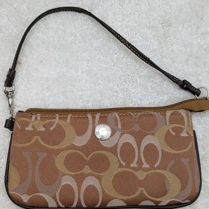 Adorable Classic Coach wristlet. Approximately 8" x 4". Assorted brown colors.